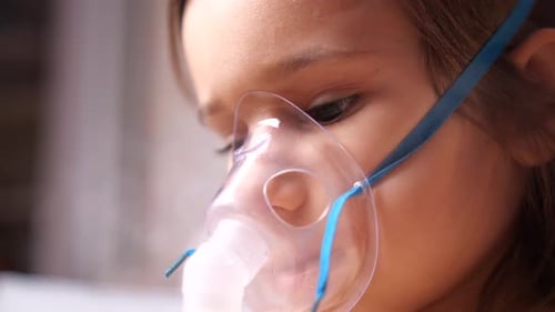Child Wearing Medical Mask for Treatment