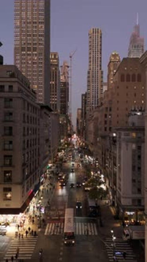 Aerial View of Cars Driving Down Fifth Avenue in Midtown Manhattan New York City at Twilight Yellow