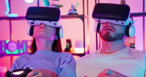 Couple Immersed in Exciting Virtual Reality Gaming