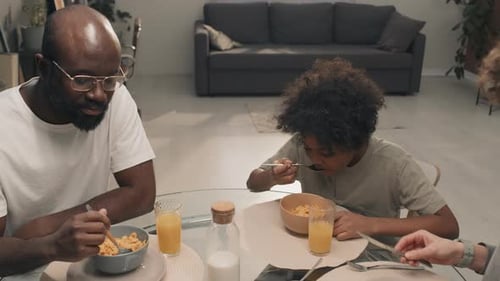 Family Enjoying Breakfast Together at Home