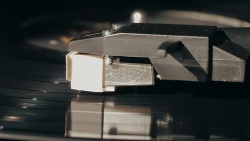 Vinyl Record Player Needle on Spinning Record