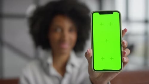 Woman Holding Smartphone with Green Screen