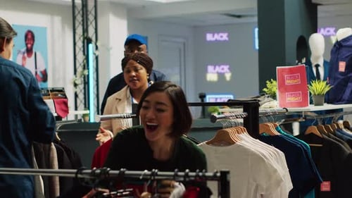 People Browsing Clothes at a Department Store