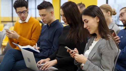 Young Adults Work in a Modern Office