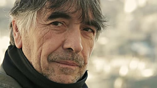 Close up of a mature man portrait lost in thought