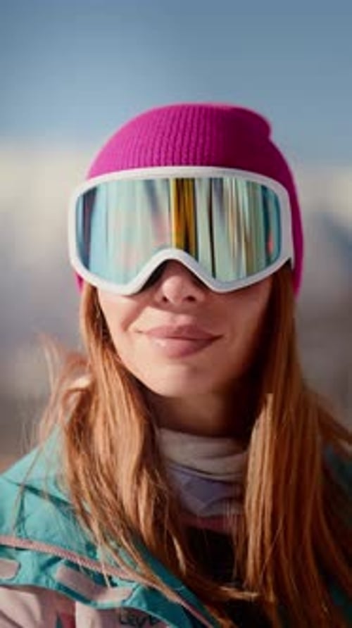 Woman Wearing Ski Goggles and Pink Hat Outdoors
