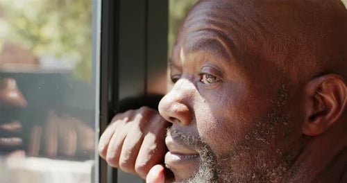 Man Looking Out Window Close Up