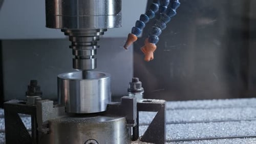 High tech metalwork process closeup of industrial drilling machine in workshop