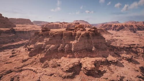 Radiant Sunlight Bathes Layered Rocks and Arid Plains Towards Horizon