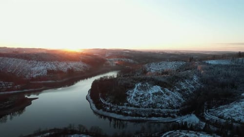 Aerial View of Snowy Landscape at Sunrise