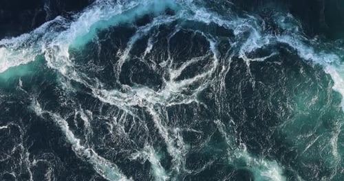 Blue waves of water of the river and the sea meet each other during high tide and low tide.