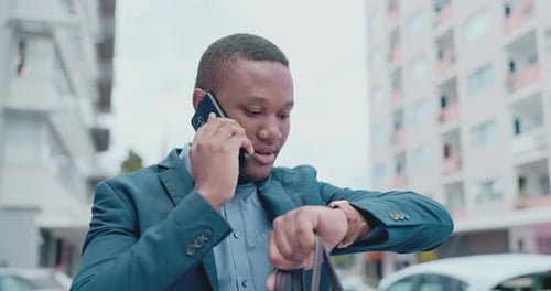 Talking, watch and a black man on a phone call for time, late and checking for schedule in city