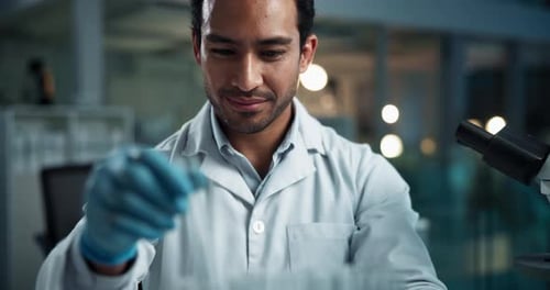 Young Adult Scientist Working in Lab