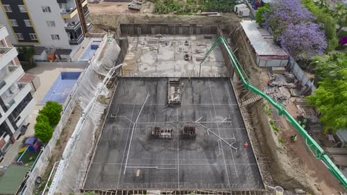 Aerial View Sewer Pipe Installation on a Busy Construction Site Workers Laying System
