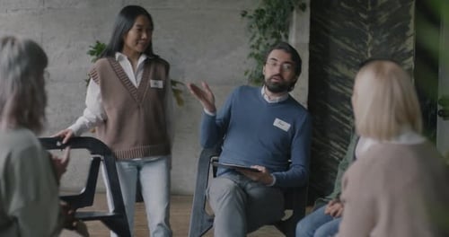 Group of Adults Engage in Workplace Meeting