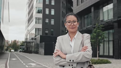Confident Woman in Business Suit in Urban Setting