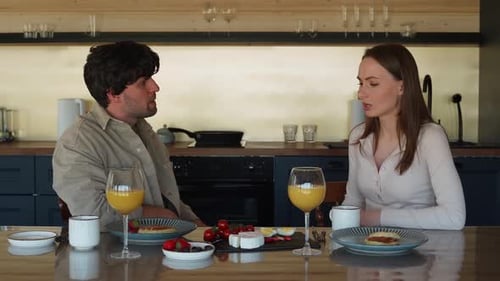 Young Couple Arguing During Breakfast at Home