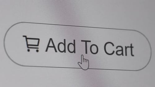 Pressing add to cart button on the computer screen
