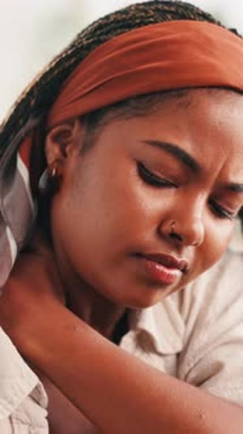 Woman Massaging Neck in Close Up