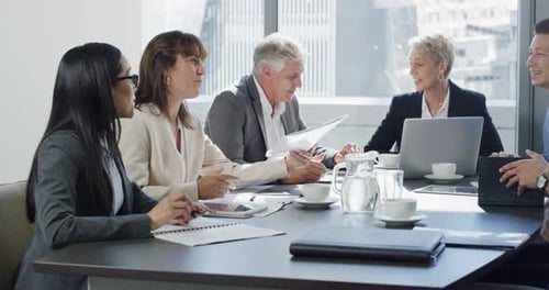 Diverse Professionals Collaborating at Modern Office Meeting