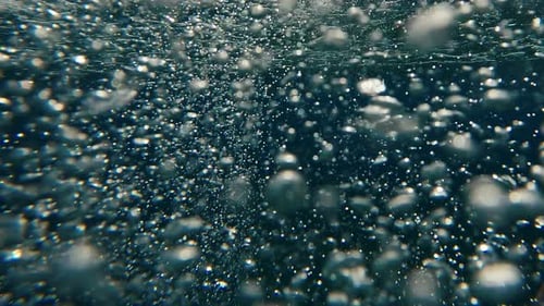 Bubbles Rising in Blue Underwater Abstract