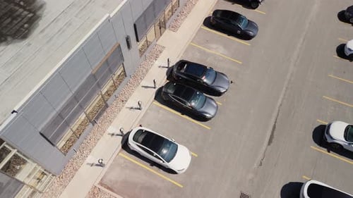 Top View Tesla Electric Cars are Charged in a Parking Lot in Dartmouth Canada
