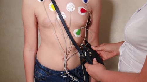 Treatment of Heart Diseases Closeup Shot Health Control Doctor Cardiologist Examining Young Man