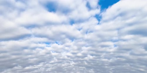 Clouds Pass By in a Blue Sky