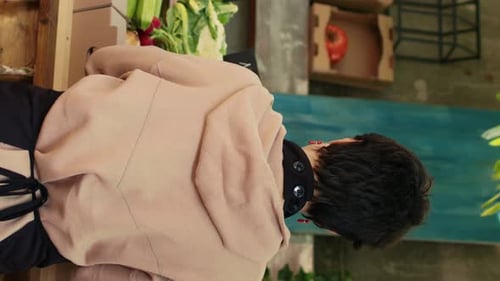 Vertical Video Farmers Market Vendor Showing Organic Produce to Clients