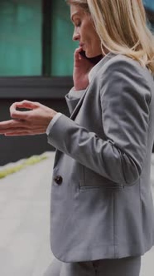 Woman Talking on Smartphone in Urban Setting