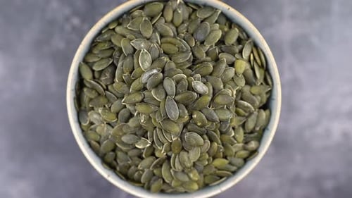 Healthy Organic Pumpkin Seeds, Close-up Of Pumpkin Seeds In Bowl, Healthy Vegetarian Vegan Raw Food