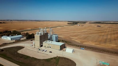4K Drone Time-lapse of a Grain Elevator Business in the Country