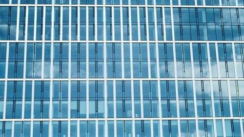 Time Lapse of a Skyscraper City Building Blue Sky and Glass Mirror Facades
