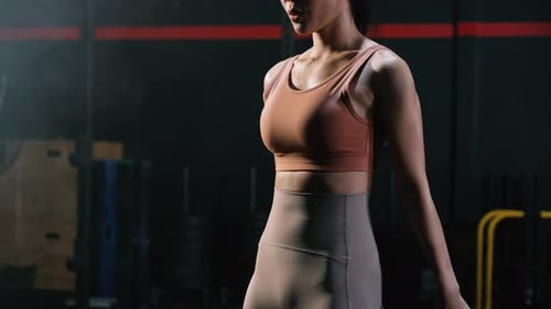 Sporty Asian Woman Exercise Doing Squat Body Weight Training Building Muscles and Burning Fat