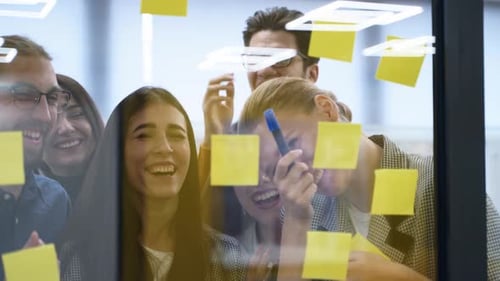 Team Brainstorming Ideas Together in Modern Office