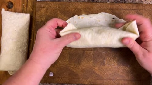 Preparing lavash with a filling of vegetables, herbs and seafood. Top view.