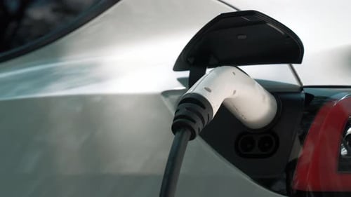 EV electric vehicle recharging battery in national park. Exalt