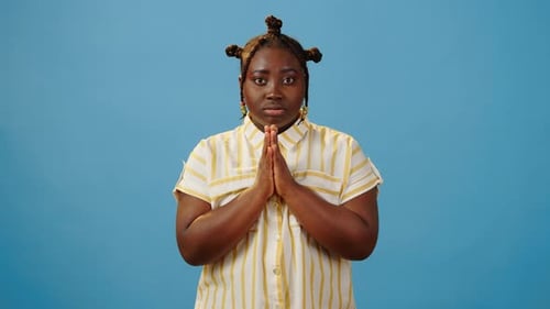 Woman Praying and Crossing Fingers