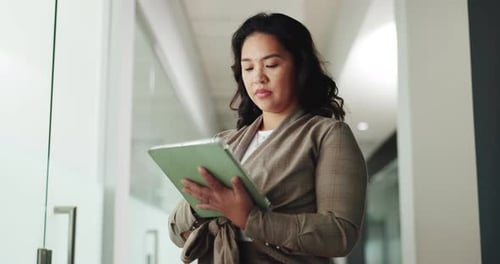 Woman, tablet and typing at office for review, proposal or investment at finance company