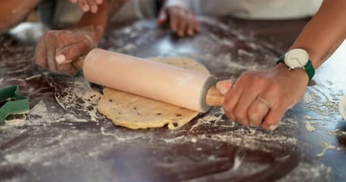 Child and Adult Rolling Cookie Dough Together