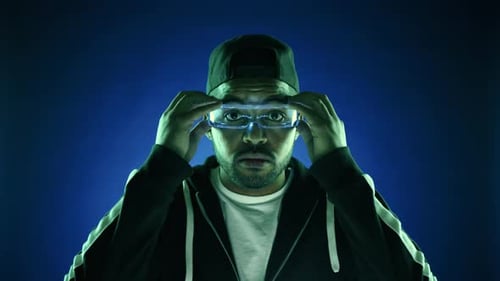Man Using Augmented Reality Glasses in Futuristic Setting