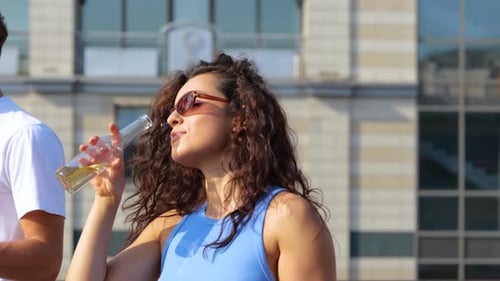 Pretty Young Female in Sunglasses Enjoying Open Air Party on the Roof Terrace While Dancing and