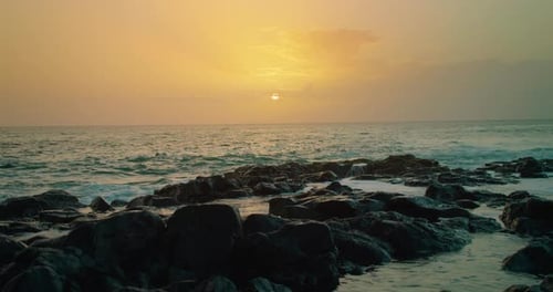 Calming Seascape During Sunset Closeup Rocky Beach Glistening Ocean Water at Dusk Sky Sea Background