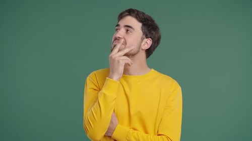 Thinking Man Looking Up Searching Opportunity On Green Background Curious