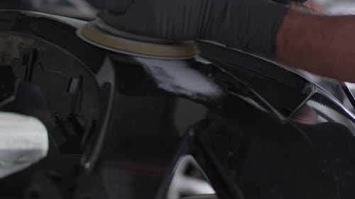 Auto Repairman Grinding Auto Body