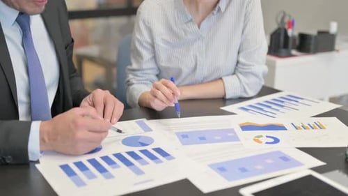 Business People Working on Documents in Office