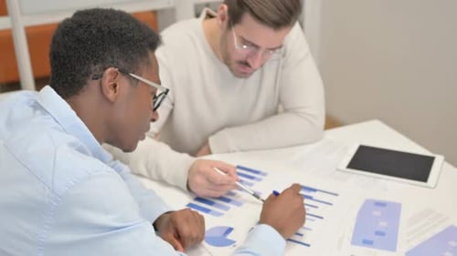 Business Analysis: Young Adults Collaborate on Data Charts