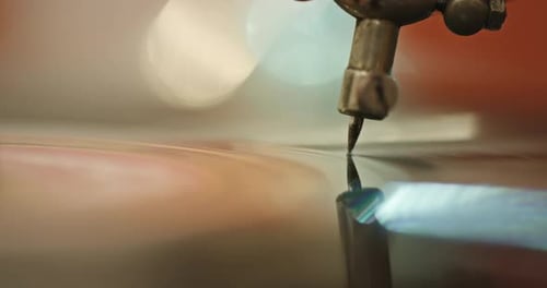 Record Player Needle on Vinyl Record Spinning