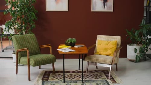 Interior of Modern Office with Armchairs and Coffee Table between Them