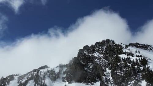 Snowy Mountain Peaks And Clouds. British Columbia, Canada.
